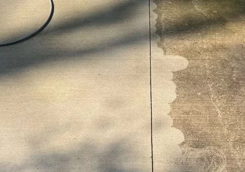 Concrete driveway being cleaned off for sealing